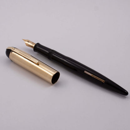 Eversharp Skyline Fountain Pen, Black Barrel and Derby, Gold Filled Lined Cap. Gold Filled Trim, Extra Fine 14k Nib Type: Restored Lever Filling Fountain Pen Product Name: Eversharp Skyline Manufacture Year: 1940's Length: 5 1/4 Filling System: Lever Fill