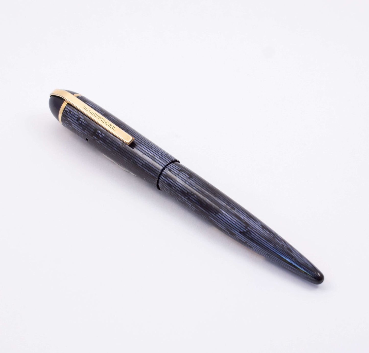 Eversharp Skyline Fountain Pen, Modern Strip Blue Cap and Barrel, Gold Filled Trim, Fine 14k Nib Type: Restored Lever Filling Fountain Pen Product Name: Eversharp Skyline Manufacture Year: 1940's Length: ﻿4 3/4 Filling System: Lever Filler, restored with