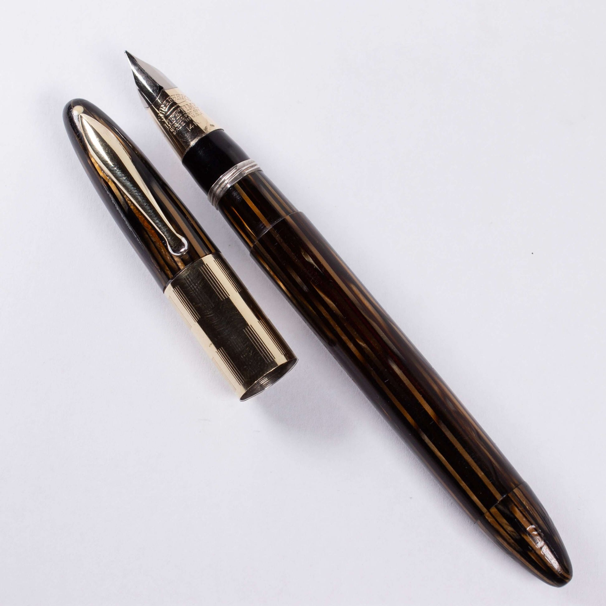 ${titleType: Vintage Vac-Fil Fountain Pen Product name: Sheaffer Triumph Vacuum-Fil Manufacturer and Year: 1940's Length: 5 1/8 inch Filling System: Vacuum-Fil, Plunger, restored with new section and piston Color/Pattern: Golden Brown Nib Type/Condition a