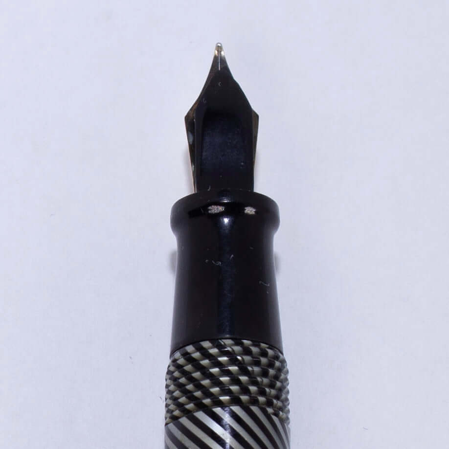 ${titleName/Type: Vacuum-Fil, Twist filler Manufacture Year: 1930s Length: 5 Filling System: Twist Fill, Fill by turning yellow knob, it wrings out the sac. Color/Pattern: Black and Grey Spiral Nib Type/Condition and remarks: 12K Gold Flexy nib, #3 size.