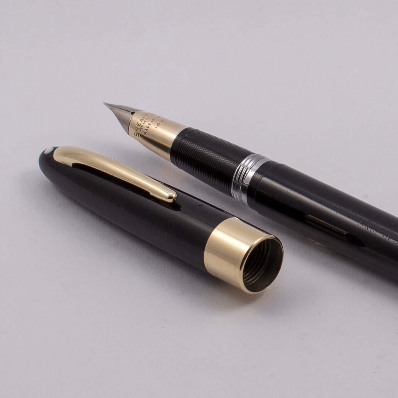 ${titleType: Restored Vintage Sheaffer Fountain Pen Product Name: Sheaffer Valiant Snorkel Manufacture Year: 1952-1959 Length: 5 9/16 Filling System: Snorkel Filler, Restored with new sac and O-ring Color/Pattern: Black with gold plated trim Nib Type/Cond
