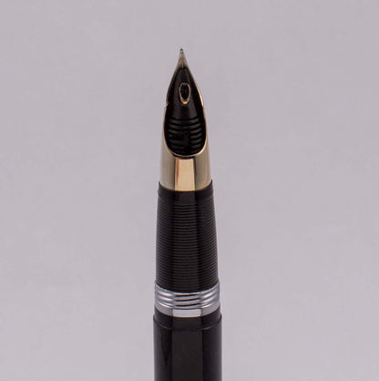 ${titleType: Restored Vintage Sheaffer Fountain Pen Product Name: Sheaffer Valiant Snorkel Manufacture Year: 1952-1959 Length: 5 9/16 Filling System: Snorkel Filler, Restored with new sac and O-ring Color/Pattern: Black with gold plated trim Nib Type/Cond
