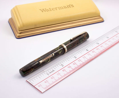 Waterman's 94 Restored Fountain Pen, Moss-Agate, Fine Rigid Keyhole Nib Type: Waterman's Model 94 Product Name: Manufacture Year: 1930's Length: 5 Filling System: Lever Filler, restored with new sac and is in working condition Color/Pattern: Moss-Agate Ni