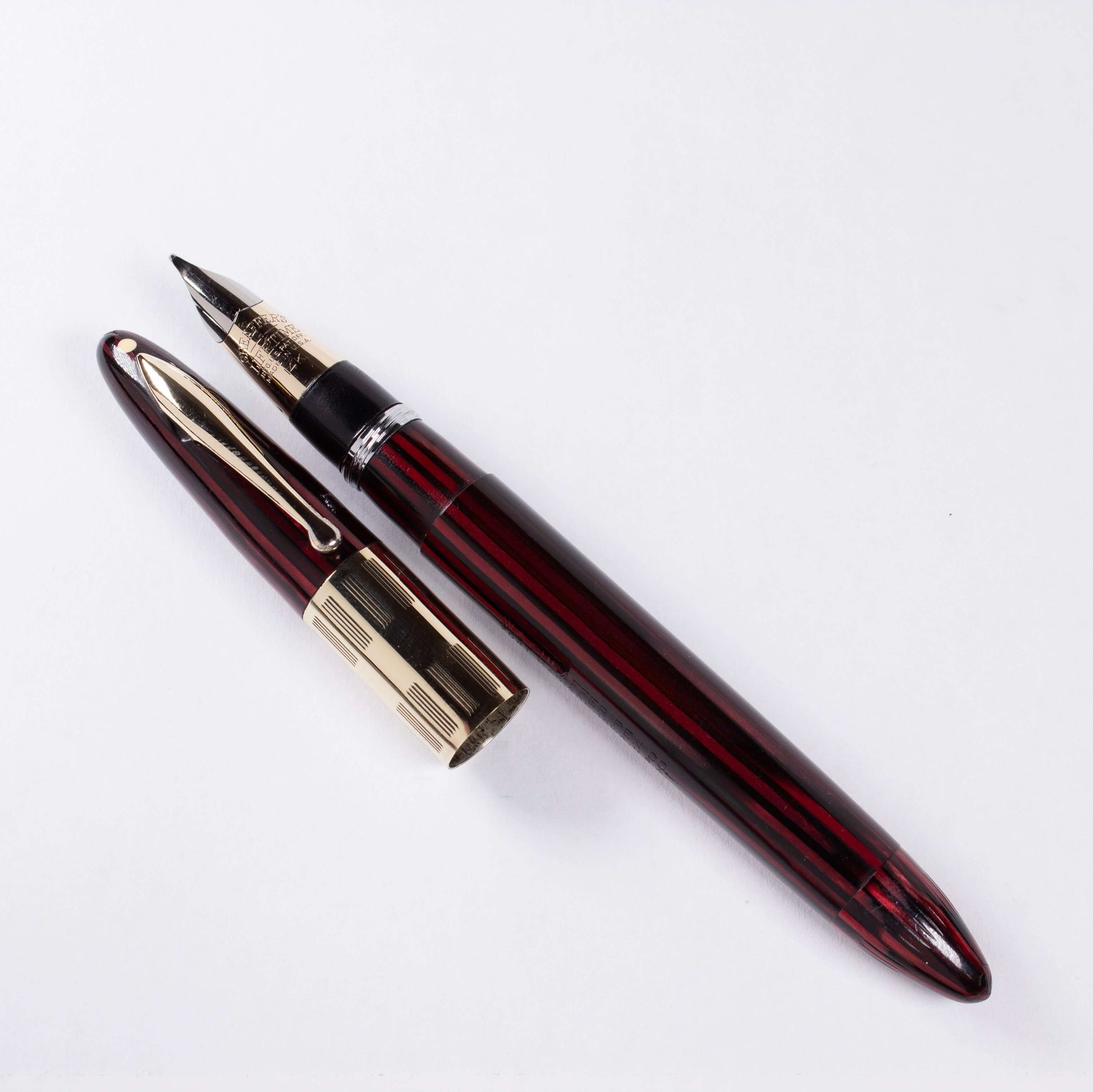 ${titleType: Vintage Vac-Fil Fountain Pen Product name: Sheaffer Triumph Vacuum-Fil Manufacturer and Year: 1940's Length: 5 1/8 inch Filling System: Vacuum-Fil, Plunger, restored with new section and piston Color/Pattern: Carmine Red Nib Type/Condition an