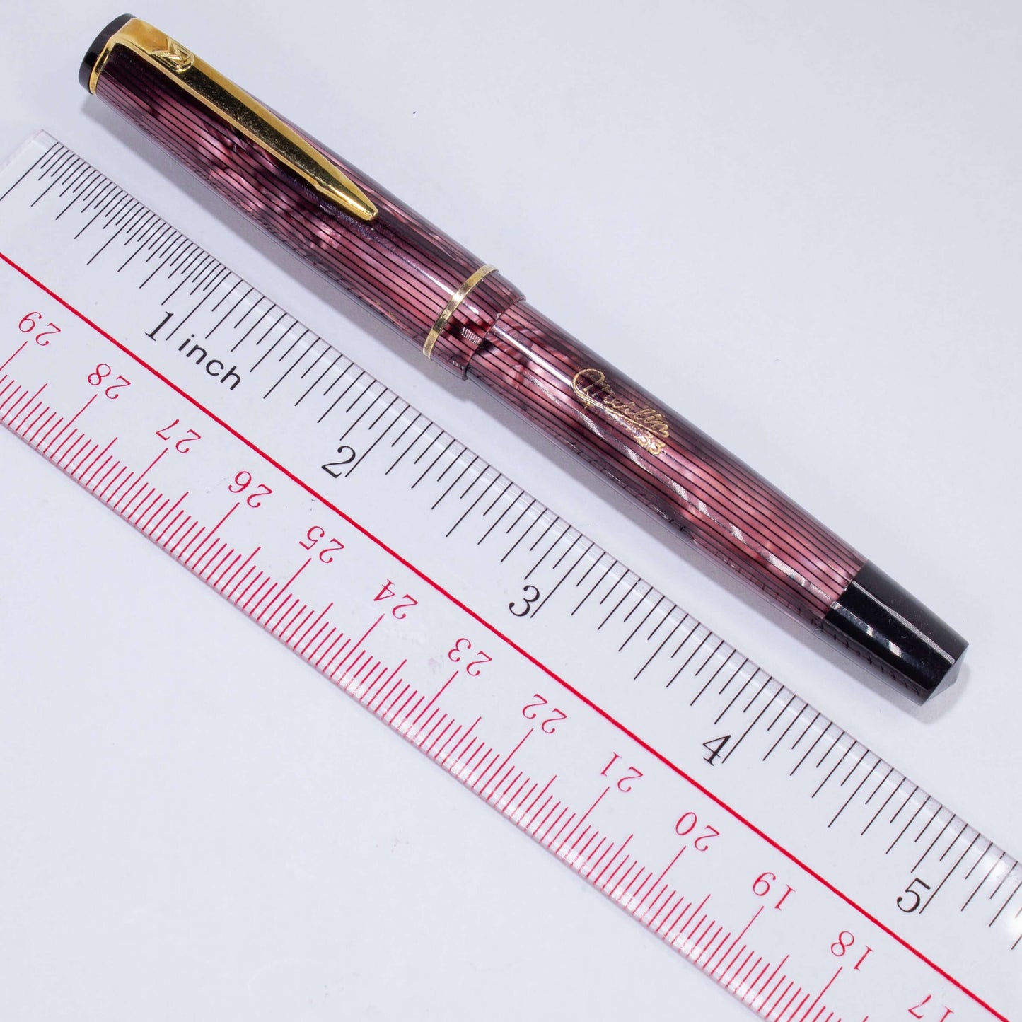 Merlin 33 Fountain Pen, Pink Stripe, Gold Trim 14K Merlin Nib, Flexible, Button Filler with New Sac Installed Type: Vintage Button Filler Fountain Pen Product Name: Merlin Manufacture Year: 1950s, made in Europe Length: 4 3/4 Filling System: Button Filler