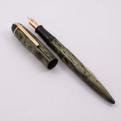 Eversharp Skyline Fountain Pen, Modern Strip Green Cap and Barrel, Gold Filled Trim, Fine 14k Nib Type: Restored Lever Filling Fountain Pen Product Name: Eversharp Skyline Manufacture Year: 1940's Length: ﻿5 1/4 Filling System: Lever Filler, restored with