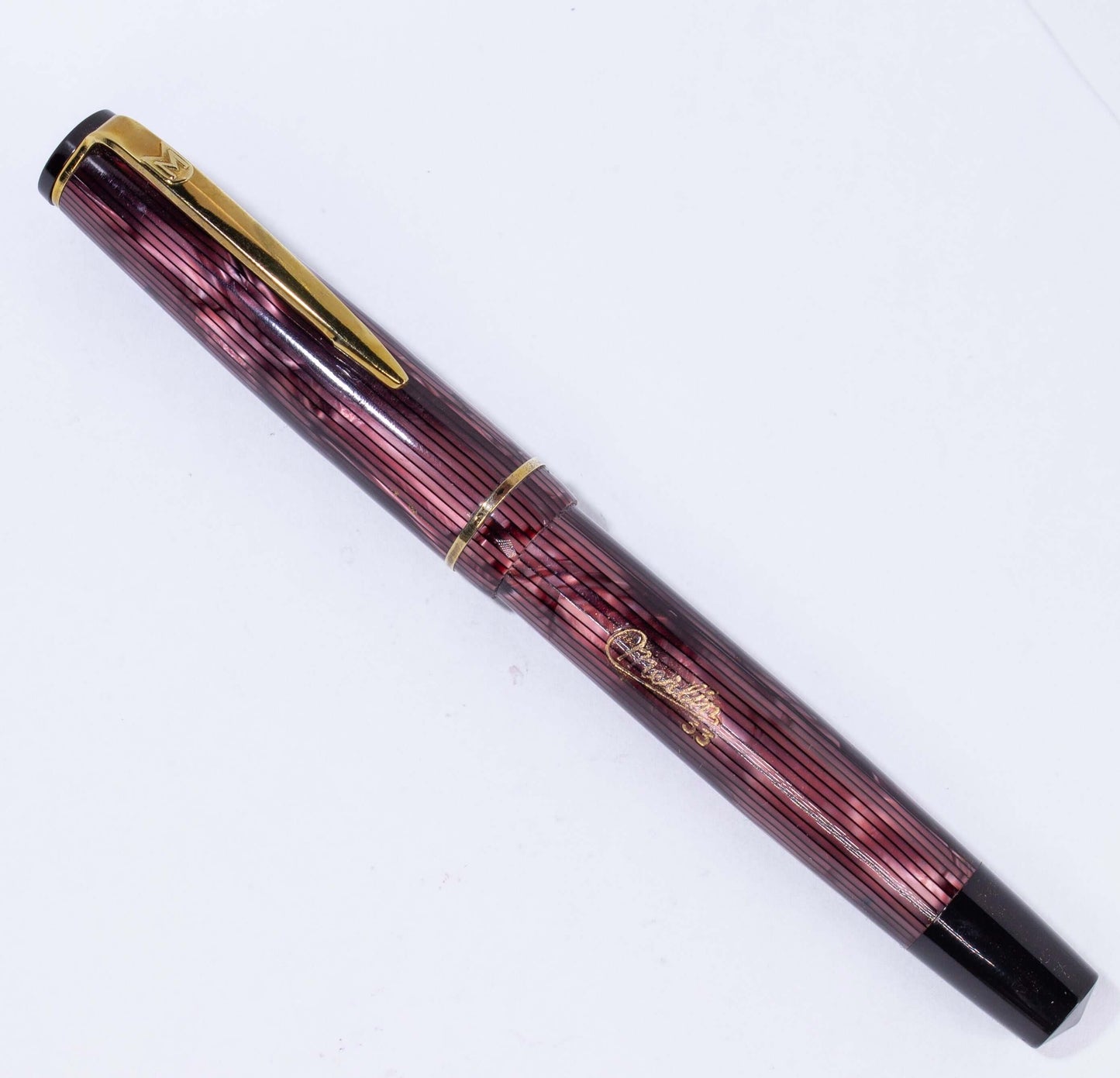 Merlin 33 Fountain Pen, Pink Stripe, Gold Trim 14K Merlin Nib, Flexible, Button Filler with New Sac Installed Type: Vintage Button Filler Fountain Pen Product Name: Merlin Manufacture Year: 1950s, made in Europe Length: 4 3/4 Filling System: Button Filler