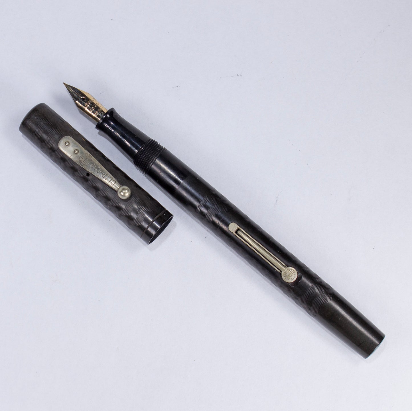 ${titleName/Type: Waterman 52 Manufacture Year: 1920s Length: 5 1/2 Filling System: Lever Filler, restored with new sac Color/Pattern: Black hard rubber, with very strong chasing and imprints. Nib Type/Condition and remarks: Waterman #2 responsive semi-fl