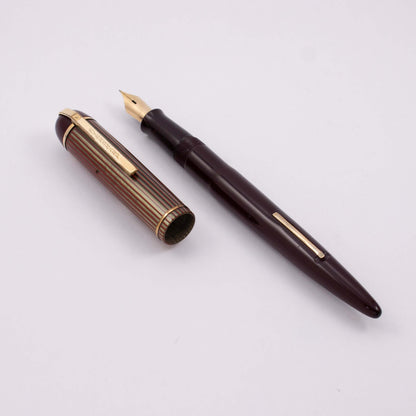 Eversharp Skyline Fountain Pen,Burgundy Barrel, Red-Green Striated Cap, Gold Filled Trim, Extra Fine 14k Nib Type: Restored Lever Filling Fountain Pen Product Name: Eversharp Skyline Manufacture Year: 1940's Length: ﻿5 1/4 Filling System: Lever Filler, re