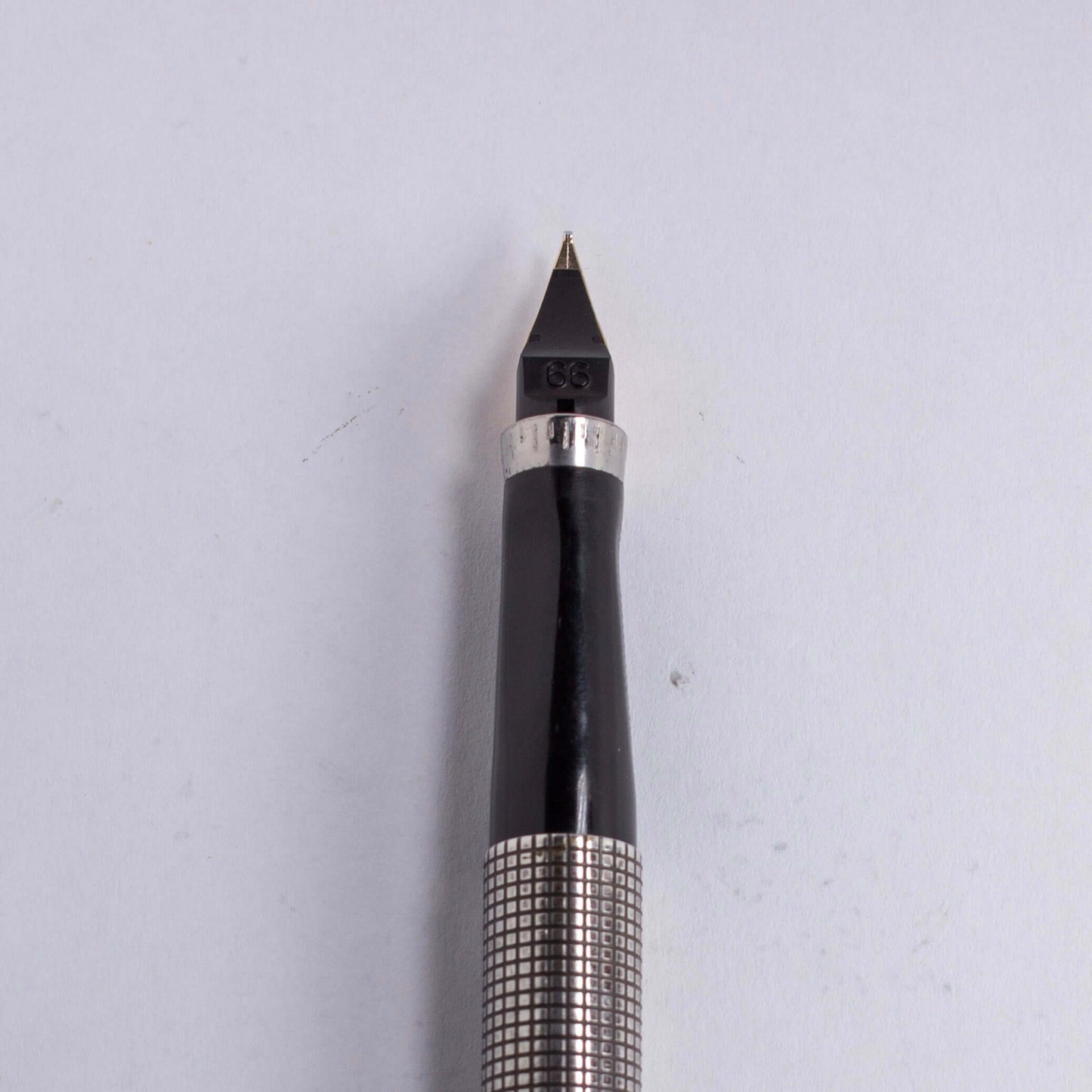 Restored Parker 75, Sterling Silver Ciselé, Medium 14K nib .66, Made in U.S.A.Name/Type: Parker 75 Manufacture Year: 1970's Length: 5 1/8 Filling System: Parker Cartridges or Converter Color/Pattern: Sterling Silver Ciselé Nib Type/Condition and remarks: