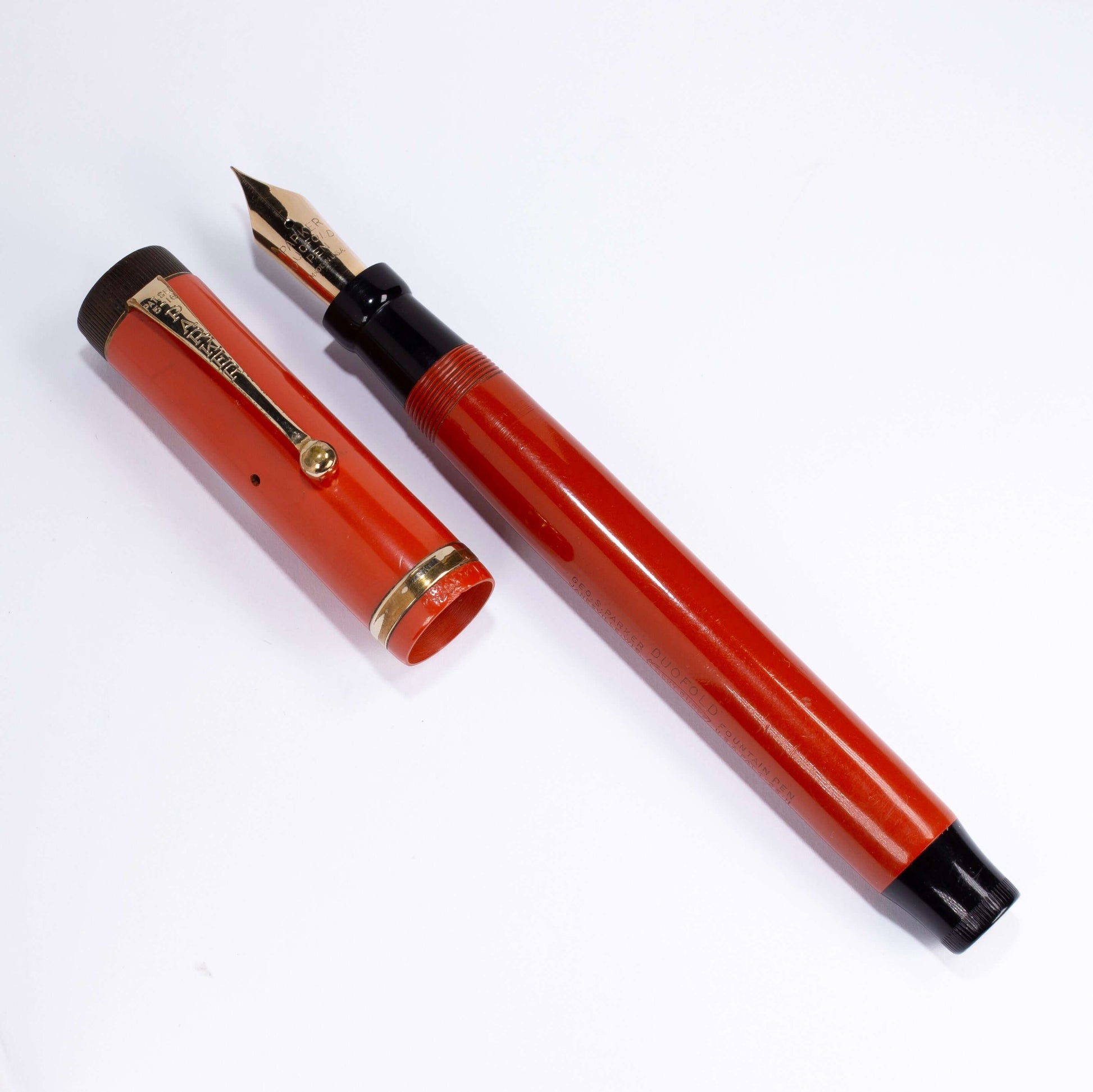 Parker Duofold Senior, Red Hard Rubber, Raised Cap Band, Button Fill, Large 14K Gold Duofold nib. Comes in original box with instruction sheet. Name/Type: Parker Senior Duofold Manufacture Year: 1920s Length: 5 1/2 Filling System: Button filler; Restored