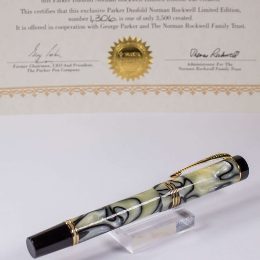 Parker Duofold Norman Rockwell Limited Edition Black and Pearl Fountain Pen, 18K Medium nib. This Parker Duofold Norman Rockwell Limited Edition Fountain Pen is number 1306 of only 3,500 produced. It features a black and pearl swirl pattern only used for