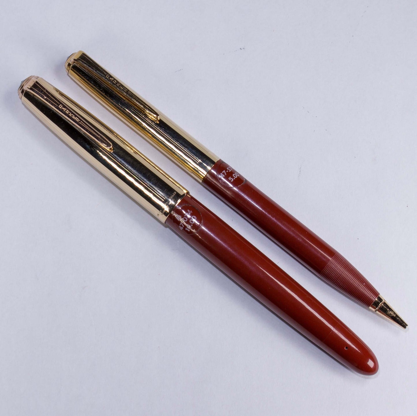 Parker VS Fountain Pen/Pencil Set, Rust, Button Filler, 14K Gold Filled Caps, StickeredName/Type: Restored Vintage Parker VS Fountain Pen/Pencil Set Manufacture Year: 1947 Length: 5 1/2 Filling System: Button Filler, restored with new sac. Color/Pattern: