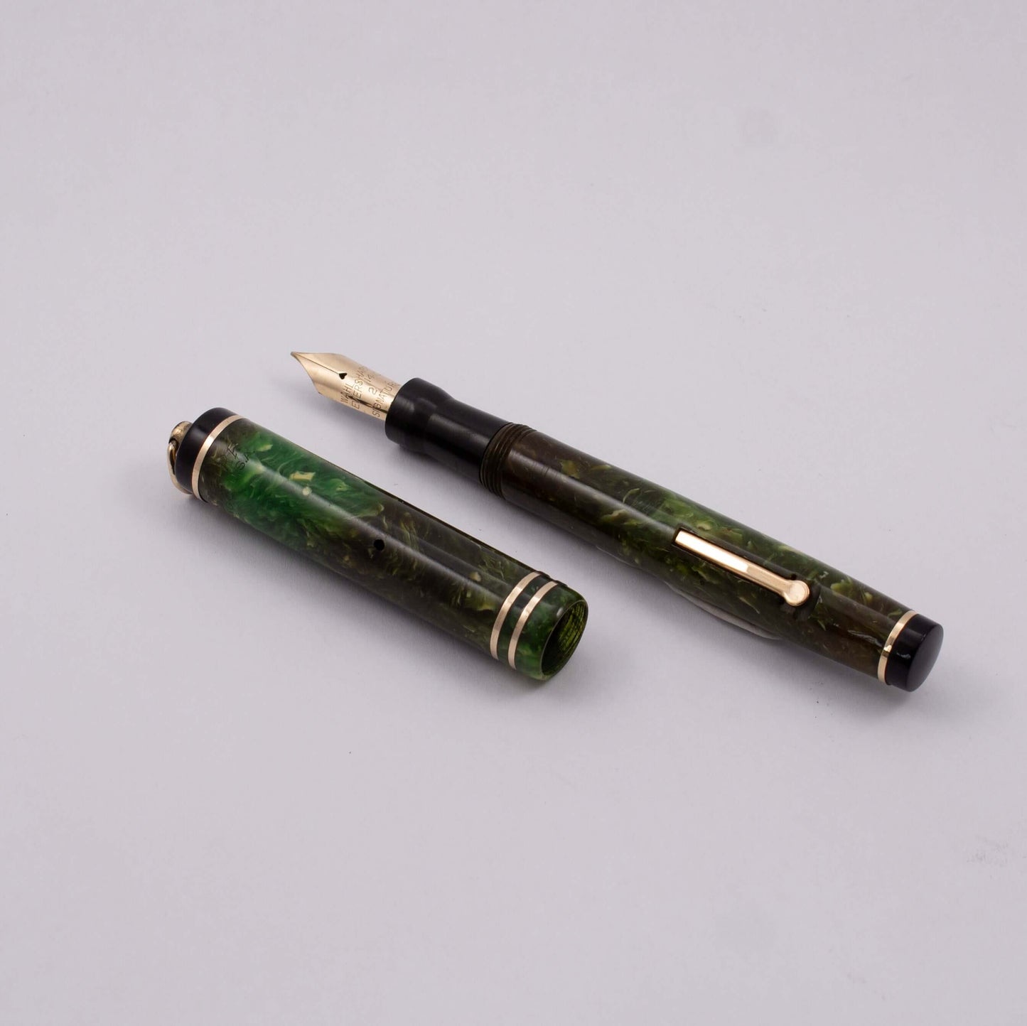Wahl Eversharp Fountain Pen, Jade Green, Ring top, Lever Filler, 14k Gold Fine Nib Type: Restored Lever Filler Fountain Pen Product Name: Wahl Eversharp Manufacture Year: 1920's Length: 4 3/8 Filling System: Lever Filler, restored with new sac. Color/Patt