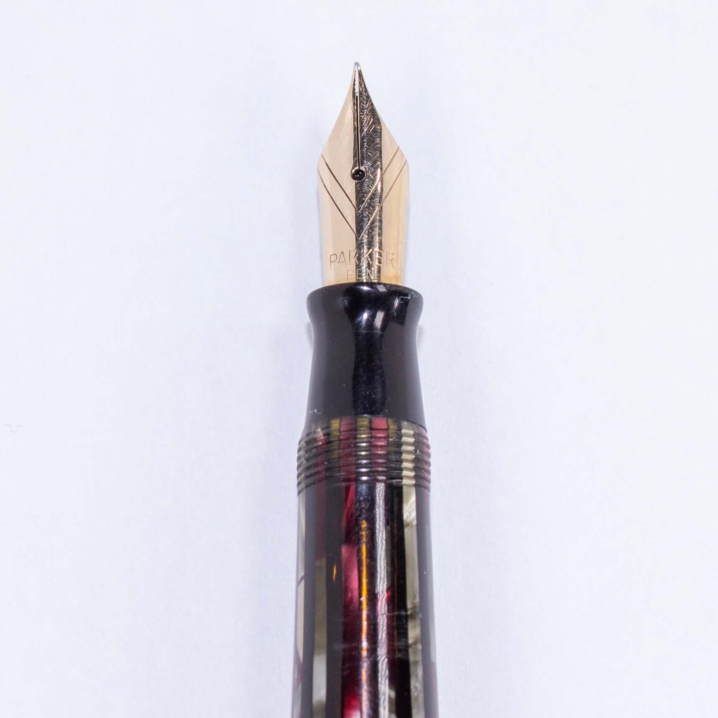 Parker Striped Duofold- Duovac, 14K "V" Nib, Dusty Red, Restored Vintage Fountain PenName/Type: Parker Duovac Manufacture Year: 1945 Length: 5 1/4 Filling System: Restored Vacumatic with plastic filler Color/Pattern: Dusty Red Nib Type/Condition and remar