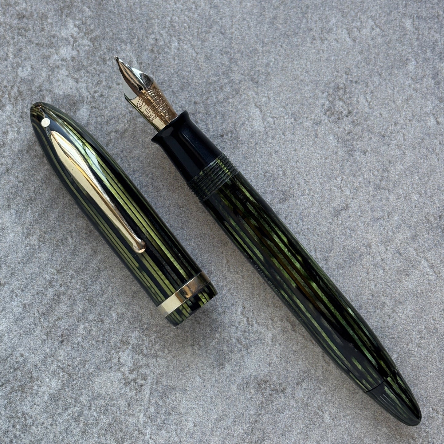 Fountain pen on a gray concrete surface