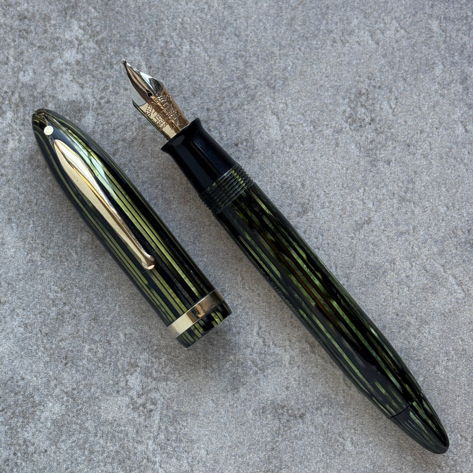 Fountain pen on a gray concrete surface