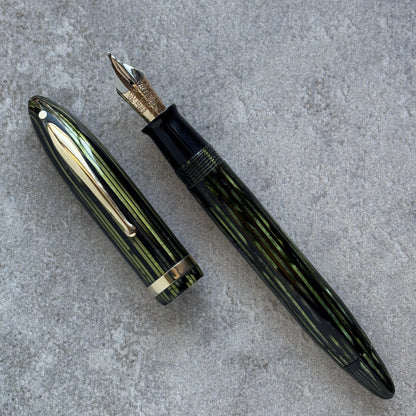 Fountain pen on a gray concrete surface