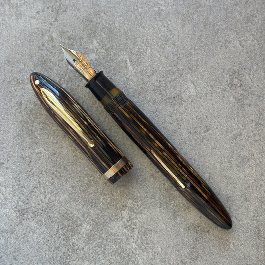 Fountain pen on a gray concrete surface