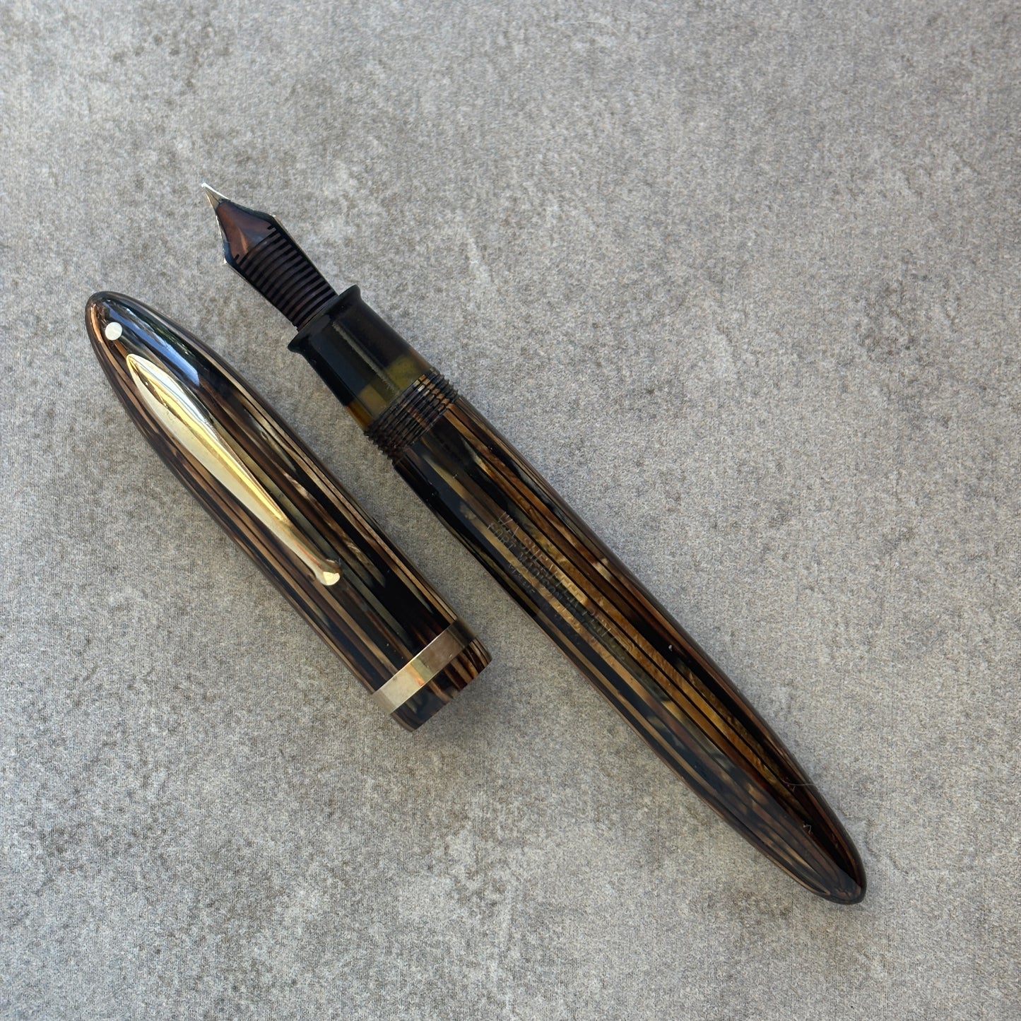 Fountain pen on a gray concrete surface