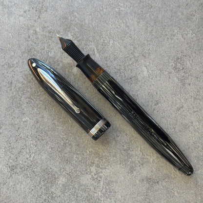 Fountain pen on a gray concrete surface