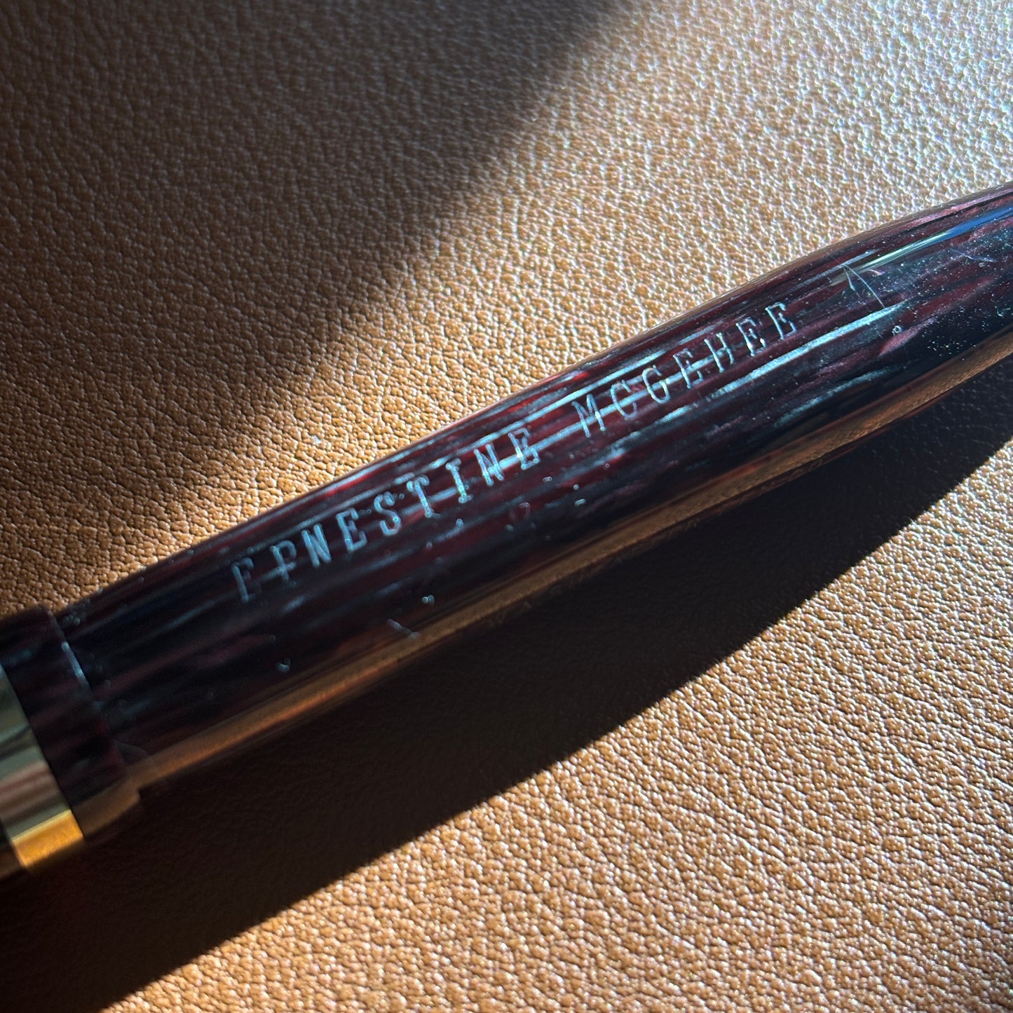 Pen with 'Ernestine McGehee.' engraving on surface